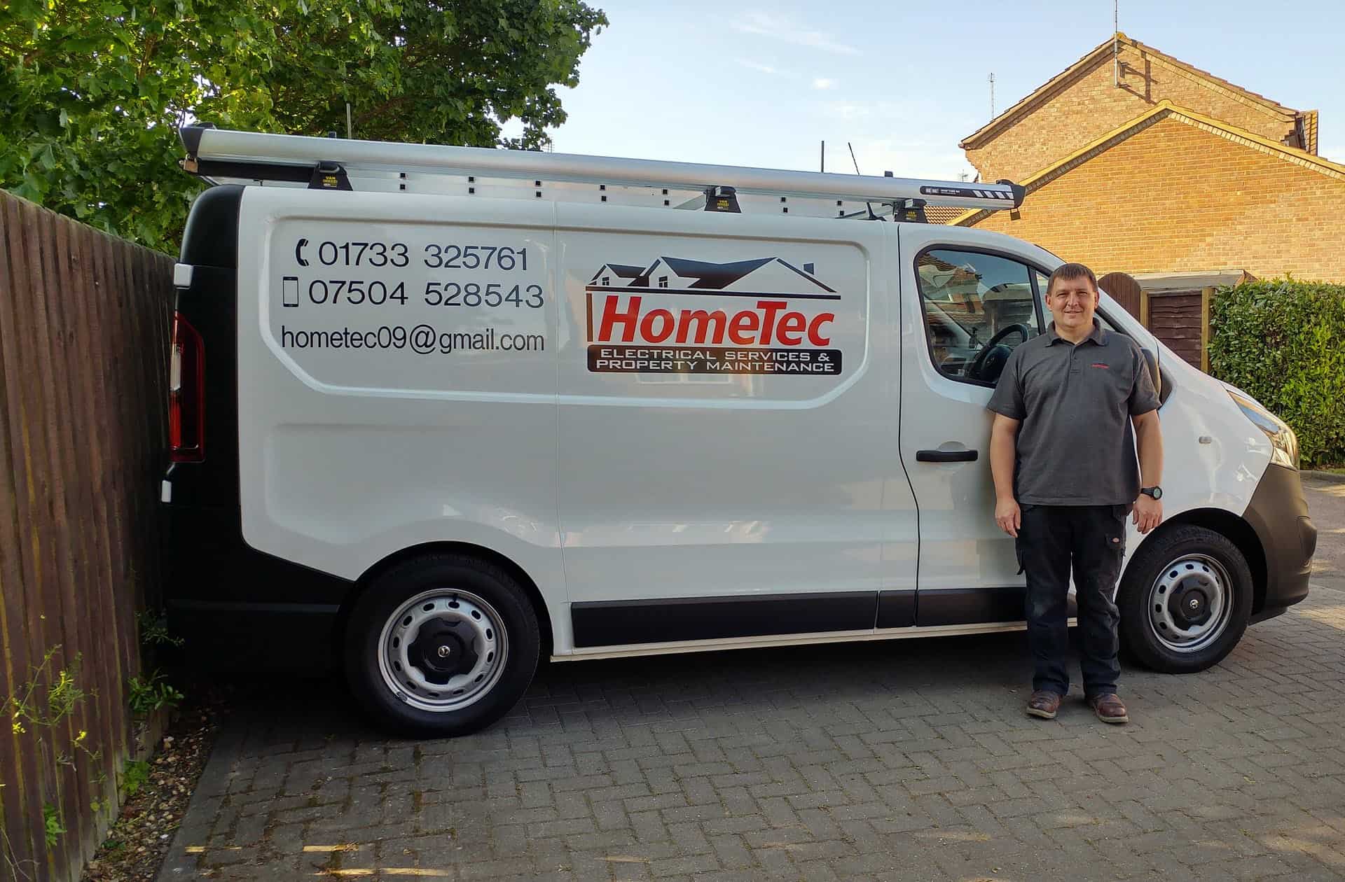 Ian Walden beside HomeTec Electrical Services and Property Maintenance van